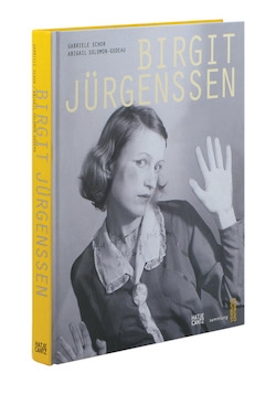 Cover of a book titled "Birgit Juergenssen" with a black and white photo of a woman pressing her cheek against glass.