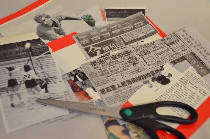 Scraps of cut-out newspapers and a pair of scissors on a surface.