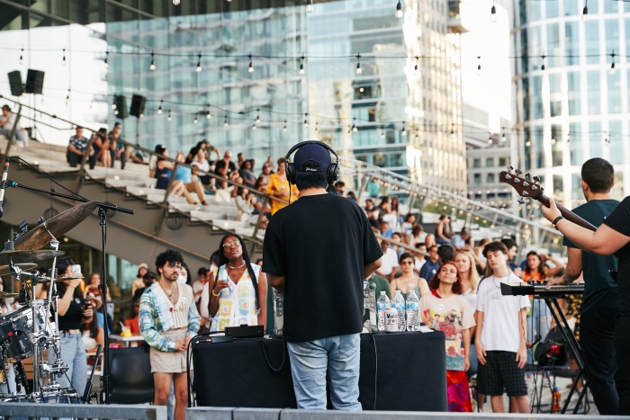 Photo of band playing outside of ICA with crowd