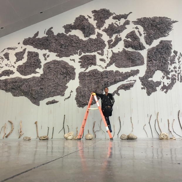 The artist Wangechi Mutu with her work A Promise to Communciate