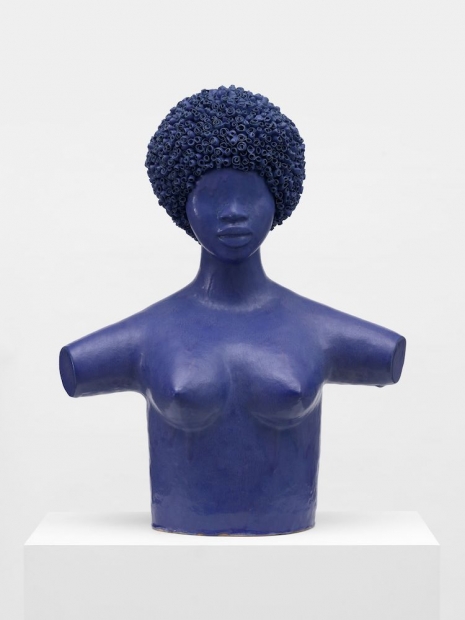 A blue bust of a woman. 