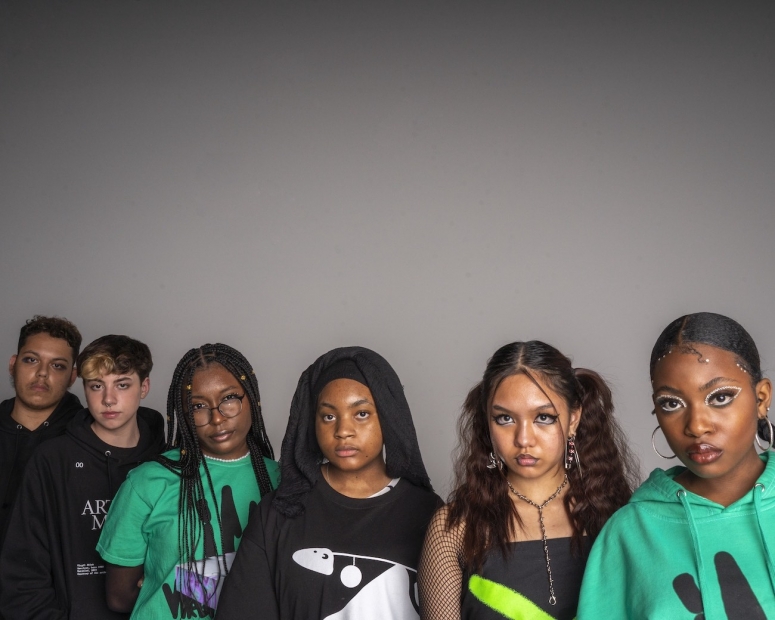 Six teenagers wearing Virgil Abloh ICA clothing stare directly at the camera in front of a neutral background.