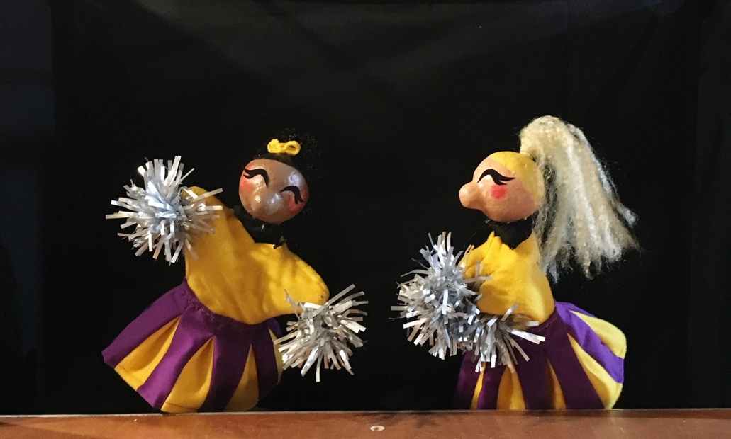 Two cheerleader puppets