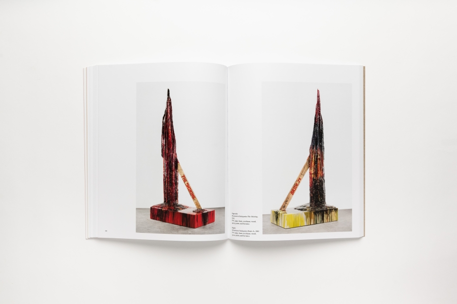 Book spread depicting two large color photos of L shaped sculptures