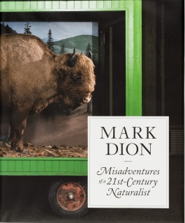 Book cover of a bison superimposed on the end of a green truck, titled "Mark Dion — Misadventures of a 21st Century Naturalist"