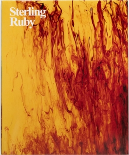 A Sterling Ruby book that is yellow with red ink swirls against a white background