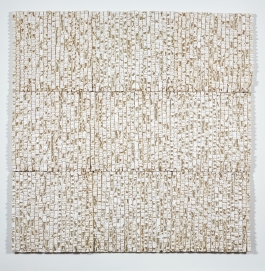A relief sculpture in a grid pattern formed by layers of cast whiteish paper.