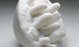 A hemispheric white marble sculpture with protruding, rounded spikes.