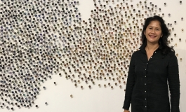 Portrait of Bennie Flores Ansell in front of her work 