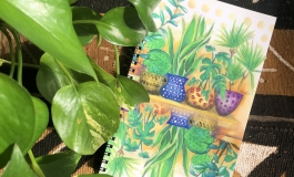 A notebook with a drawing of plants. 