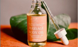 A small bottle reading "massage body oil."