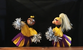 Two cheerleader puppets