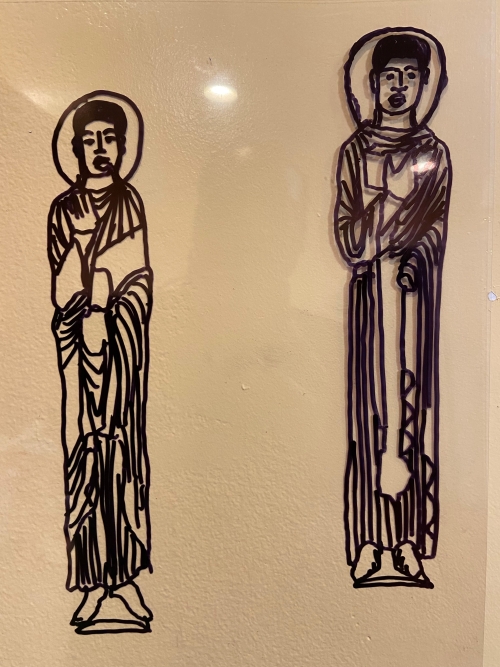 A drawing of a saint figure with a traced version of it next to it