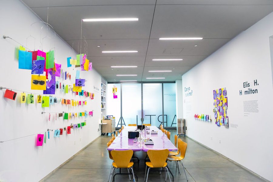 Room with table and chairs and colored paper hanging