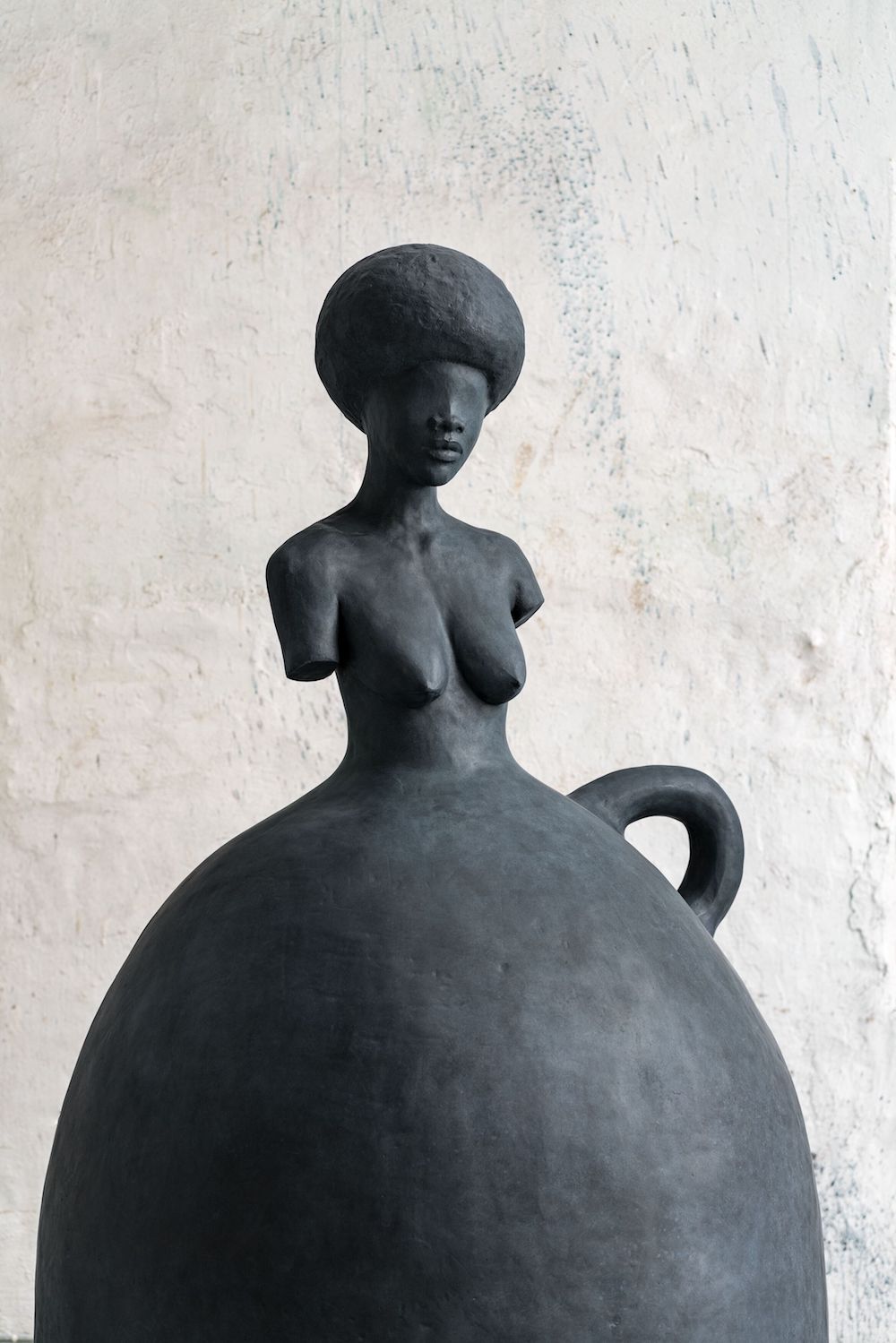 A sculpture by Simone Leigh of a female figure. 