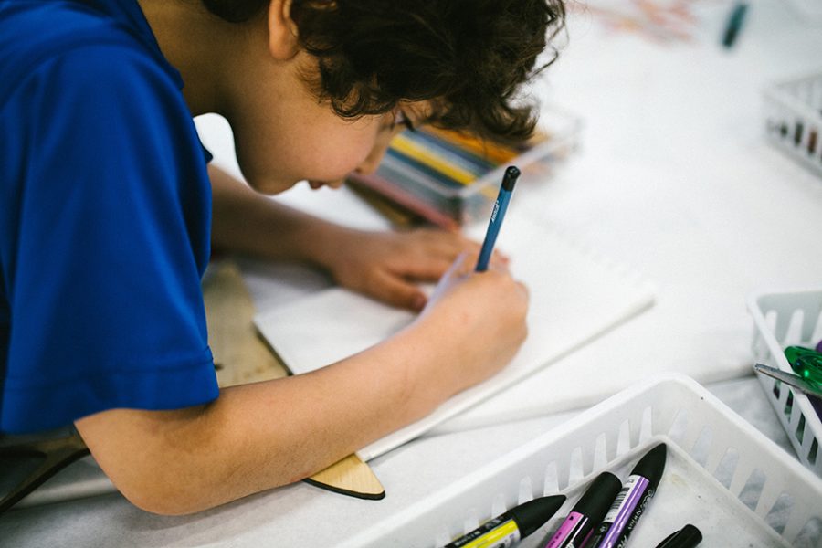 Boy making a flying fish in Art Lab