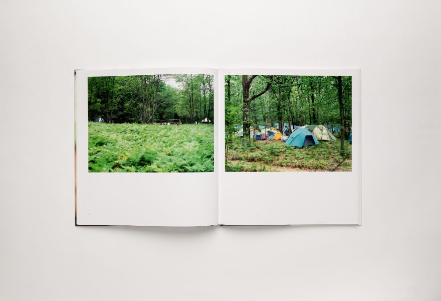 Book spread of large color photos of outdoor setting with tents on the right