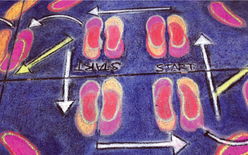 A chalk drawing on a pavement of shoes with arrows pointed counter-clockwise and the word 