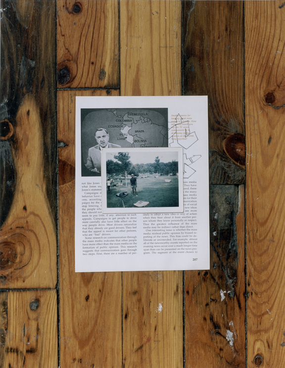 A color photograph depicts a snapshot of a Black man standing in a yard lying, on top of a page from a textbook showing a photo of Walter Cronkite next to a map of South America, displayed flat on a wooden floor.