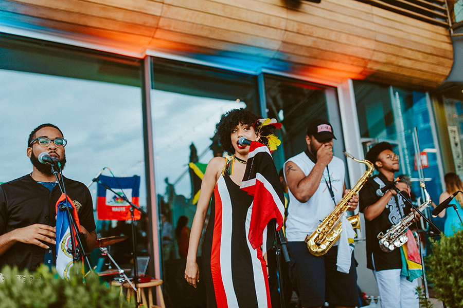 Two singers and two saxophonists play music outside at the ICA.