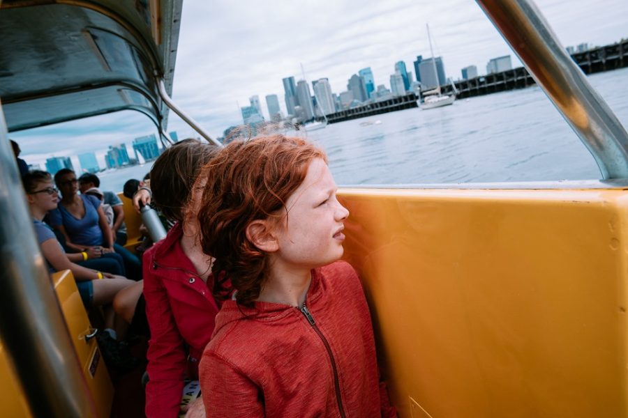 Child on a water taxi looking out over the water
