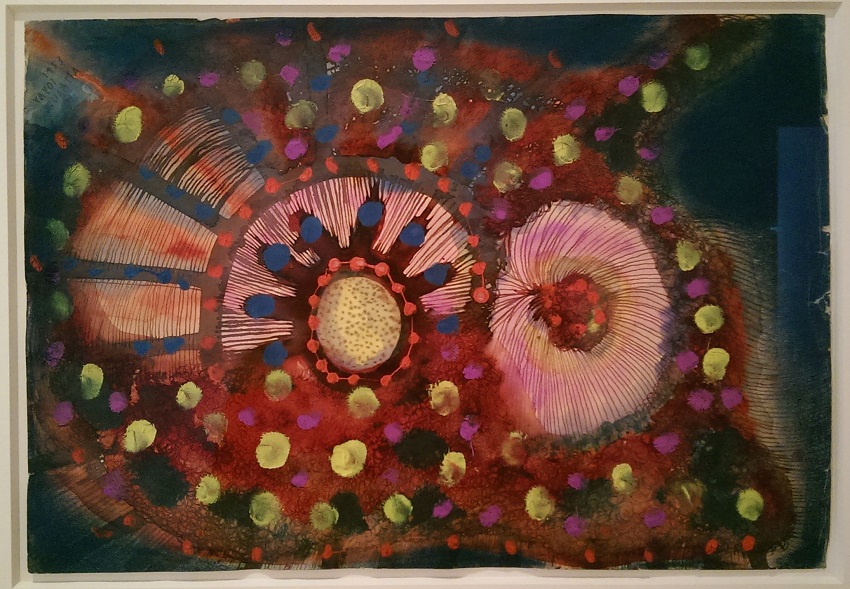 A drawing of ink, gouache, and pastel on paper depicts an abstracted scene of pink flowers blooming against a dark landscape, with various colorful geometric shapes circling them.