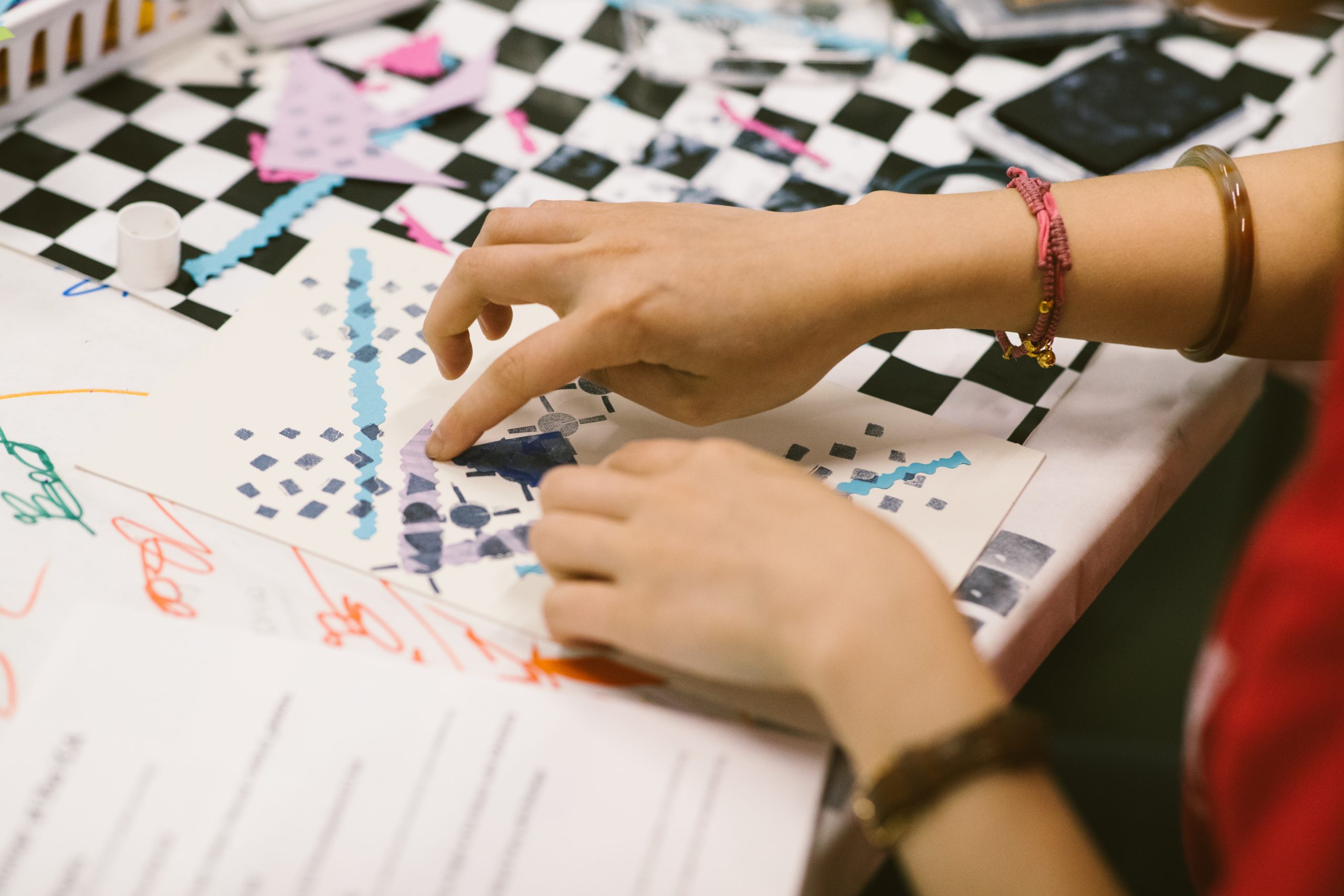 A pair of hands creating art activity