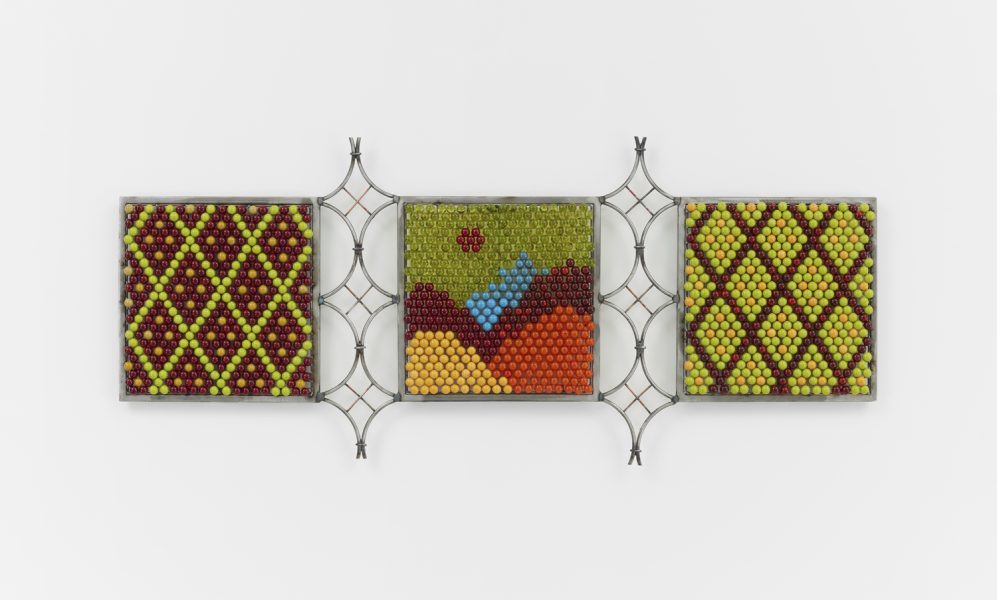 3 square images created with lime, sky blue, cranberry, and hanza yellow beads, joined by welded terraced poles. The beads are organized in an argyle-like fashion.