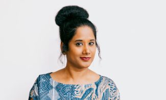 Headshot image of Anni Pullagura, Assistant Curator at the ICA/Boston, sitting