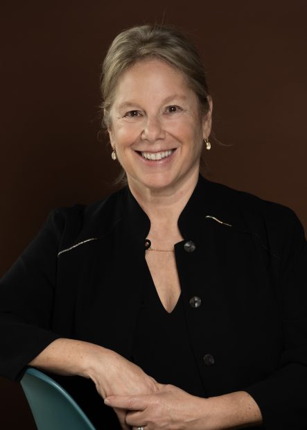 Headshot of Jill Medvedow in front of dark background