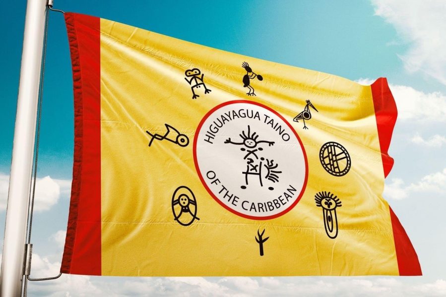 a yellow flag with a red border that reads Higuayagua: Taíno of the Caribbean