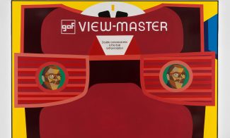A stylized illustration of a red View-Master toy against a yellow background, with two faces in its lenses. Featuring gaf VIEW-MASTER and Double consciousness is the clue: self-perception
