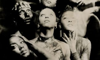 Five people pose dramatically in a black-and-white, artistic photo for Shamel Pitts TRIBE Marks of Red.