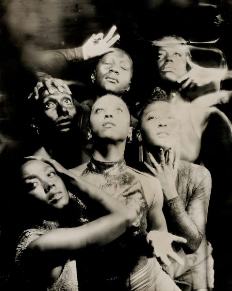 Five people pose dramatically in a black-and-white, artistic photo for Shamel Pitts TRIBE Marks of Red.