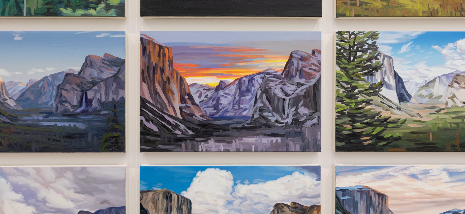 Nine oil paintings, reminiscent of Cynthia Daignault’s style showcased at ICA Boston, depict scenic mountain landscapes with dramatic clouds, lush greenery, rock formations, and a colorful sunset, all arranged in a three-by-three grid on a white wall.