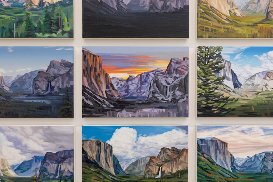 Nine oil paintings, reminiscent of Cynthia Daignault’s style showcased at ICA Boston, depict scenic mountain landscapes with dramatic clouds, lush greenery, rock formations, and a colorful sunset, all arranged in a three-by-three grid on a white wall.