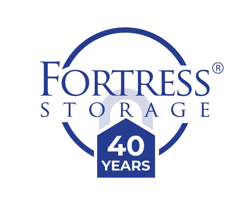 Fortress Storage logo featuring a blue circle, the company name in large blue text, and a blue shield shape with 40 YEARS in white, marking the company’s 40th anniversary.