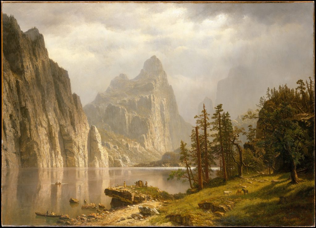 Albert Bierstadt, Merced River, Yosemite Valley, 1866. Oil on canvas. 36 × 50 inches (91.4 × 127 cm). The Metropolitan Museum of Art, NY; Gift of the sons of William Paton, 1909 A serene mountain lake scene with steep cliffs, pine trees, calm water, boats, and people on the shore. Sunlight breaks through clouds, illuminating the rocky landscape and water.