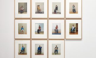 Eleven framed portraits of a woman sitting on a chair, arranged in a grid on a white wall.
